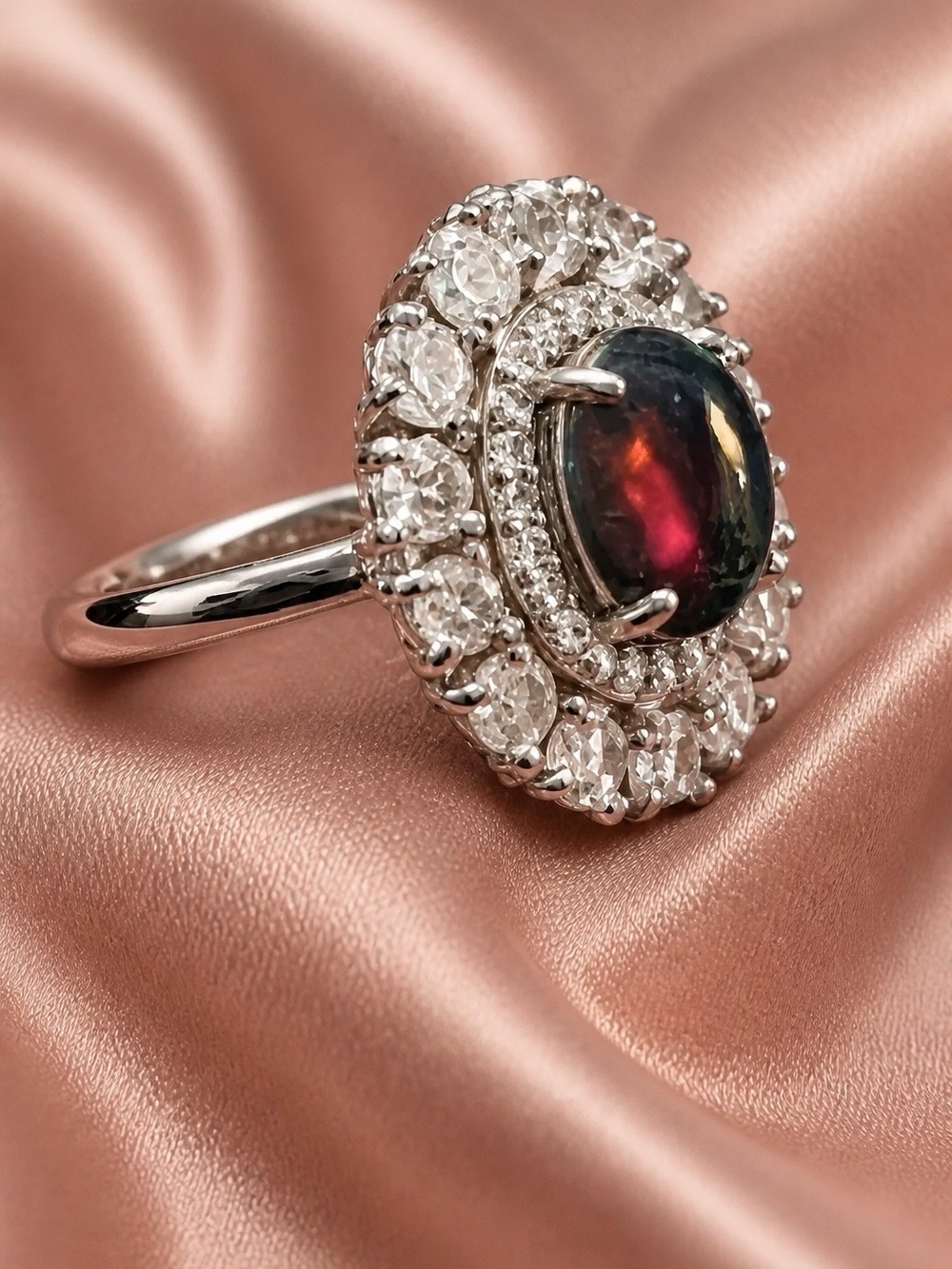 Gorgeous Black Opal Cabachon surrounded by white Topaz and 14-3mm moonstones